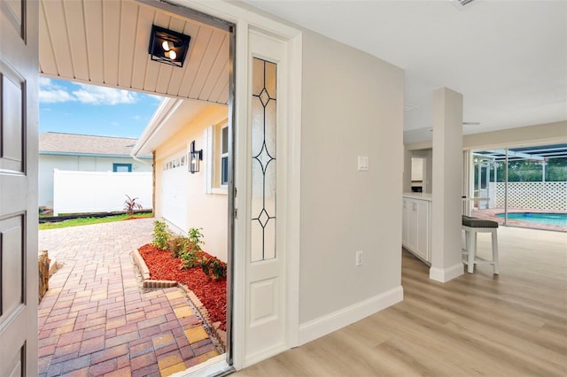 hallway with light hardwood / wood-style flooring