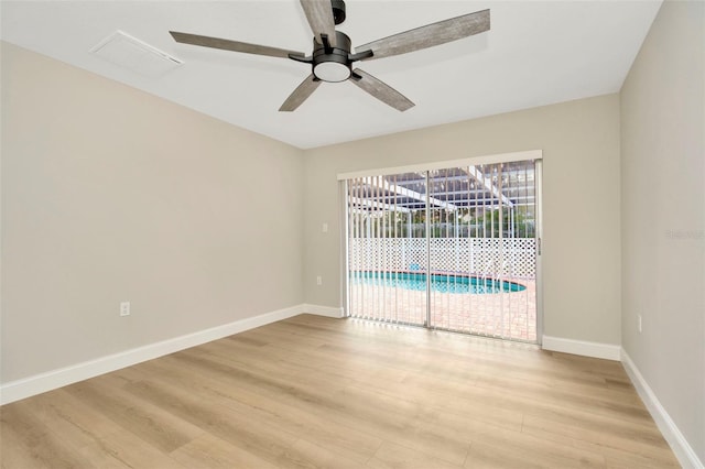 empty room featuring light hardwood / wood-style floors and ceiling fan