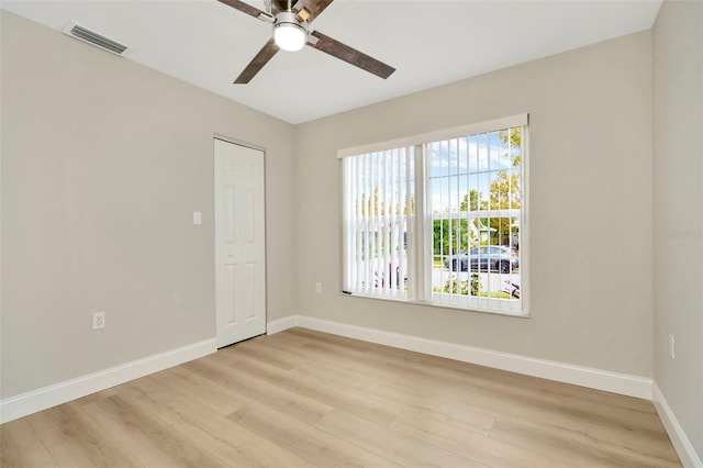 unfurnished room with ceiling fan and light hardwood / wood-style flooring