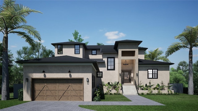 view of front of home featuring a garage and a front lawn