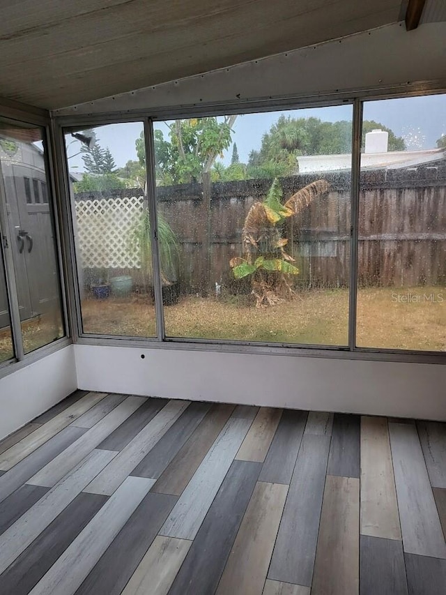 unfurnished sunroom with a wealth of natural light