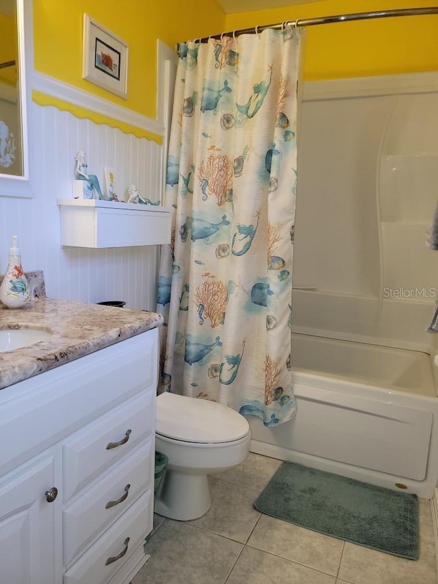 full bathroom with tile patterned flooring, shower / bath combo, toilet, and vanity