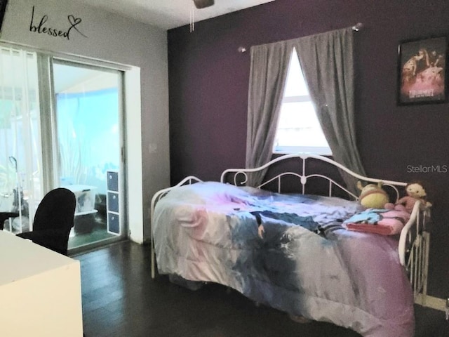 bedroom featuring dark wood-type flooring