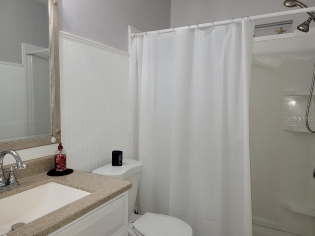 bathroom featuring vanity, a shower with shower curtain, toilet, and wood walls