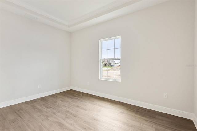 empty room featuring light wood-style flooring and baseboards