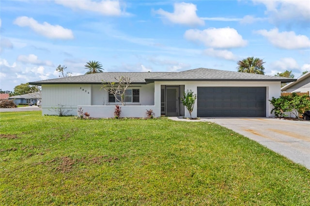 ranch-style home featuring a front lawn and a garage