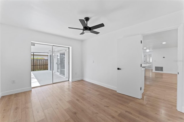 unfurnished room with ceiling fan and light wood-type flooring