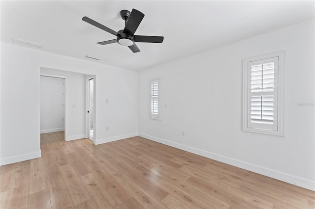 unfurnished room featuring ceiling fan and light hardwood / wood-style flooring