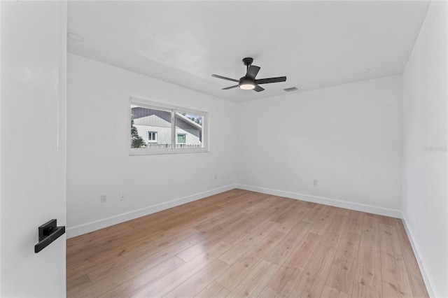 empty room with light wood-type flooring and ceiling fan