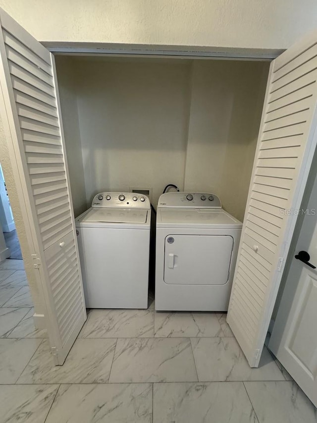 laundry room with independent washer and dryer