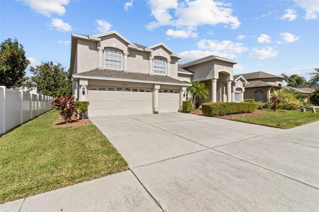 view of front property with a garage and a front lawn