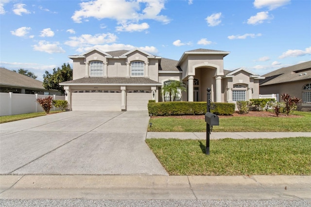 view of front of home with a garage and a front yard