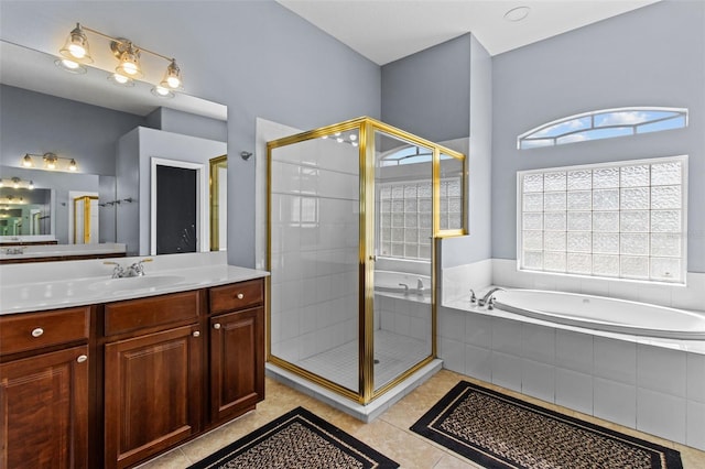 bathroom with vanity, tile patterned floors, and separate shower and tub