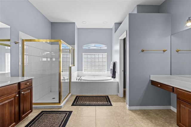 bathroom with tile patterned flooring, vanity, and separate shower and tub