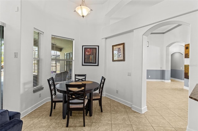 dining area featuring light tile patterned floors