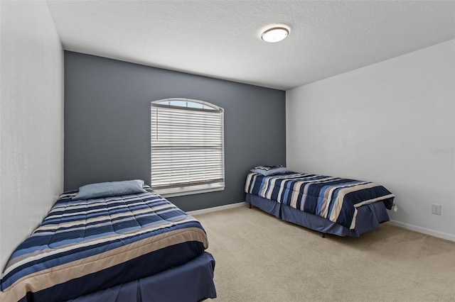 carpeted bedroom with a textured ceiling