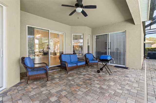 view of patio / terrace with cooling unit, ceiling fan, and an outdoor living space