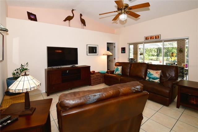 tiled living room featuring ceiling fan and lofted ceiling