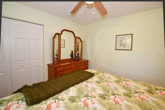 bedroom with ceiling fan and a closet