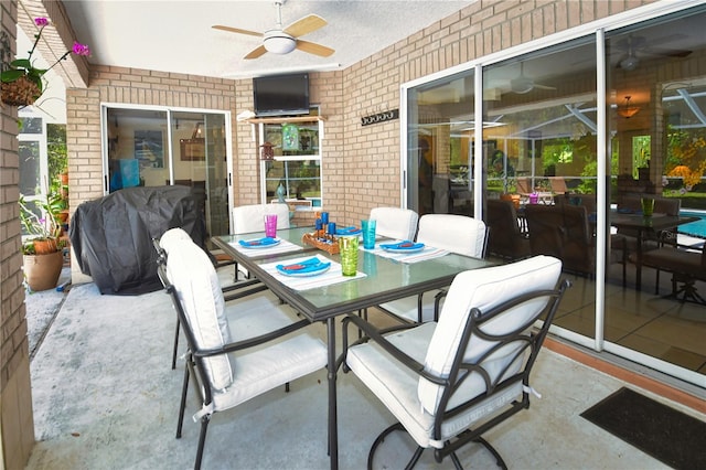 view of patio / terrace with area for grilling and ceiling fan