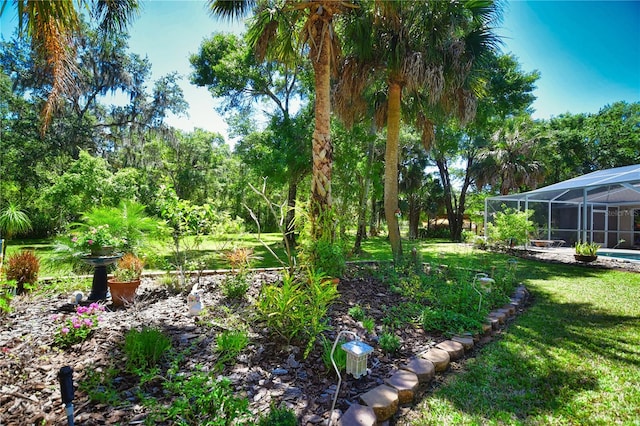 view of yard featuring a lanai