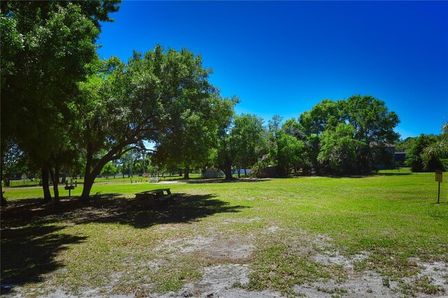 view of home's community featuring a lawn