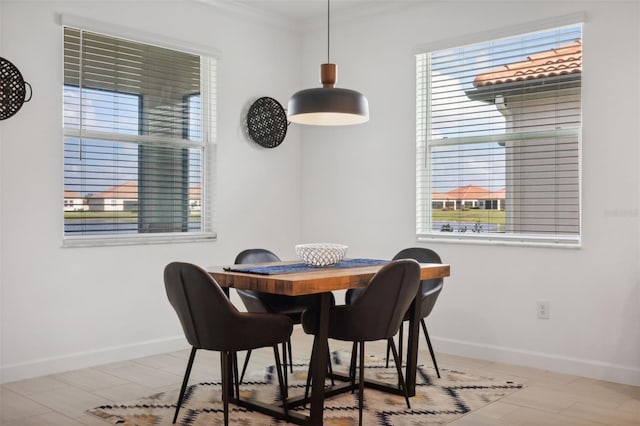 dining area featuring ornamental molding