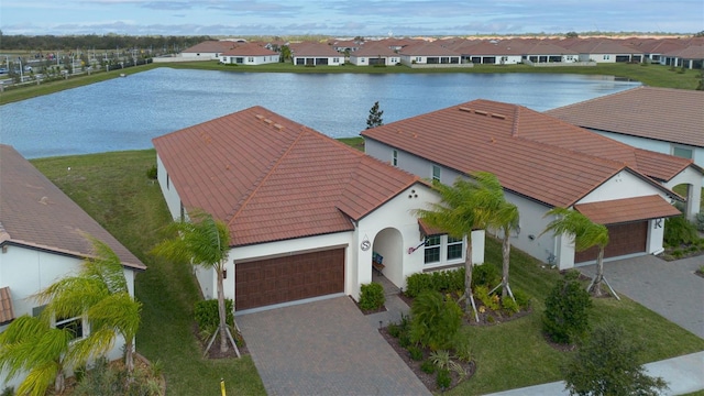 birds eye view of property featuring a water view