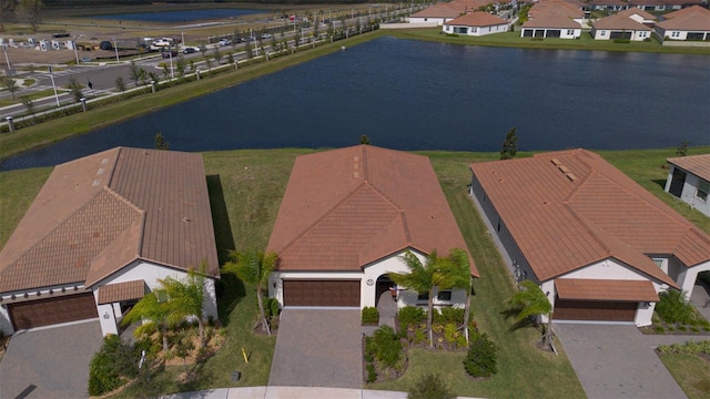 birds eye view of property featuring a water view