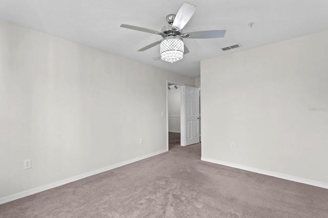 unfurnished room featuring carpet flooring and ceiling fan