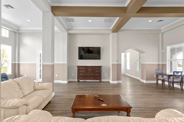 living room with beamed ceiling, ornamental molding, dark hardwood / wood-style flooring, and coffered ceiling