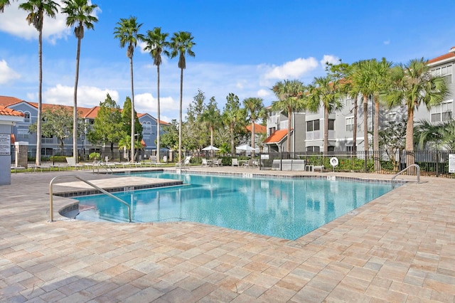 view of swimming pool with a patio area