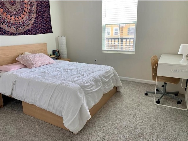 bedroom featuring light colored carpet