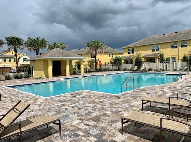 view of pool featuring a patio area and an outdoor structure