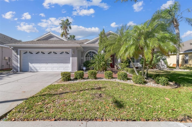 ranch-style home featuring a garage and a front lawn