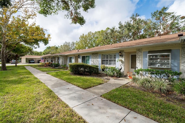 ranch-style house with a front yard