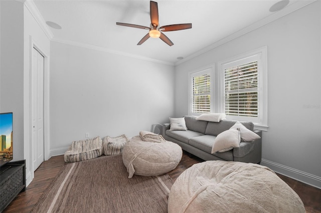 living room featuring ceiling fan, crown molding, and dark hardwood / wood-style floors