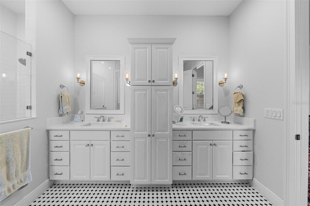 bathroom featuring a shower and vanity