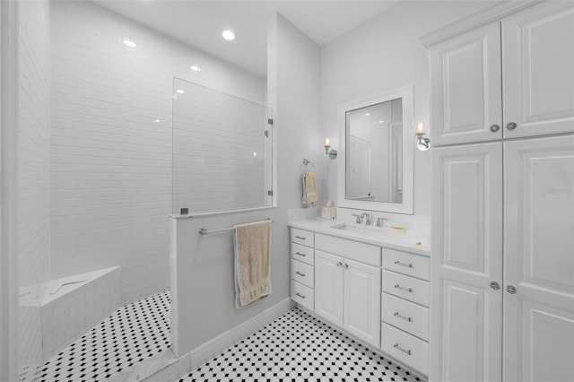 bathroom featuring vanity and a tile shower