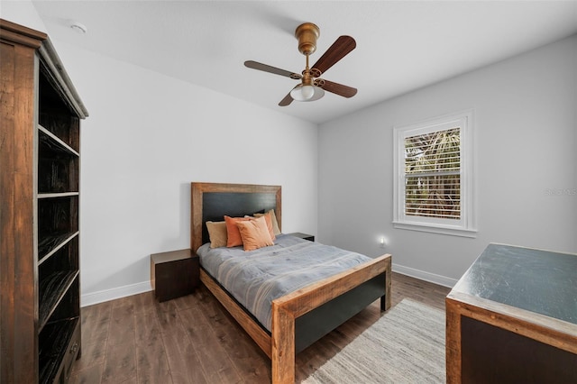 bedroom featuring ceiling fan and dark hardwood / wood-style flooring