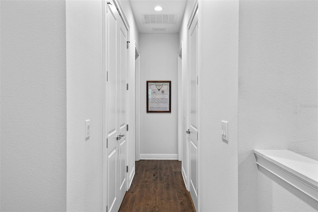 hall with dark hardwood / wood-style flooring