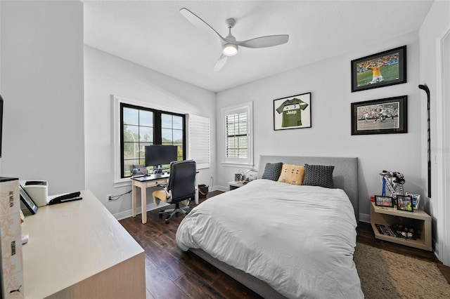 bedroom with ceiling fan and dark hardwood / wood-style floors