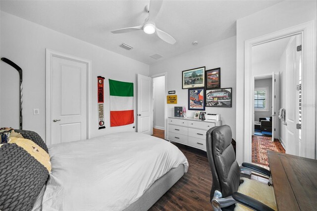 bedroom featuring dark wood-type flooring and ceiling fan