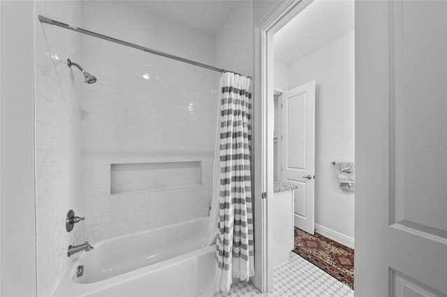 bathroom featuring shower / tub combo with curtain and tile patterned floors