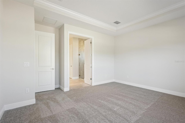 empty room featuring visible vents, baseboards, crown molding, and light colored carpet