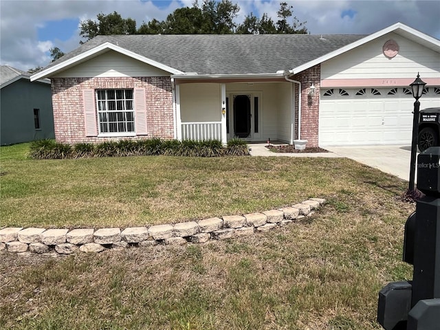 ranch-style house with covered porch, a garage, and a front lawn