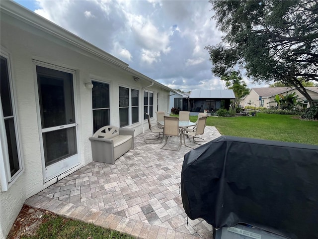 view of patio featuring a grill