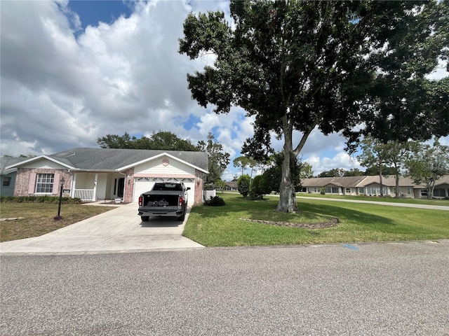 view of front facade with a garage and a front lawn