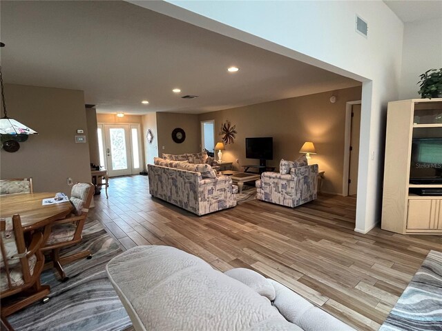 living room with light hardwood / wood-style floors