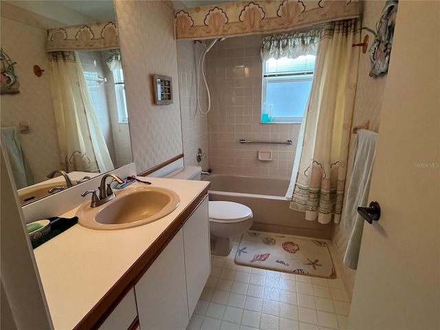 full bathroom with vanity, toilet, and shower / bath combo with shower curtain